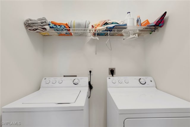 laundry area with separate washer and dryer