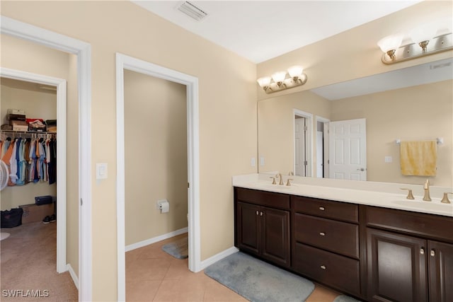 bathroom with vanity and tile patterned floors