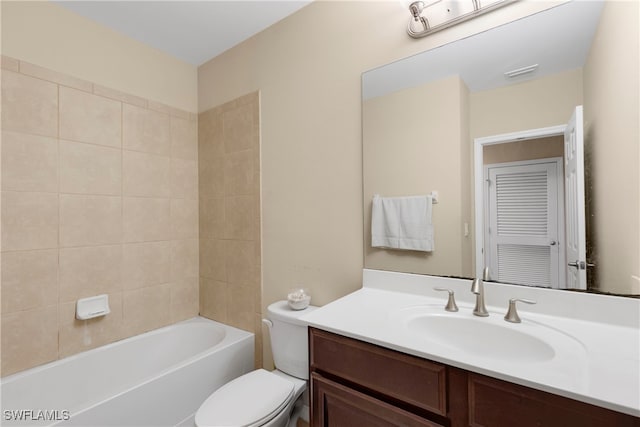 full bathroom with vanity, toilet, and tiled shower / bath combo