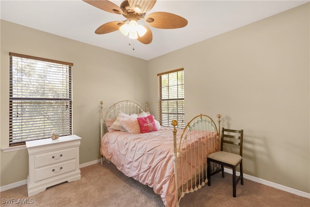 bedroom featuring light carpet and ceiling fan