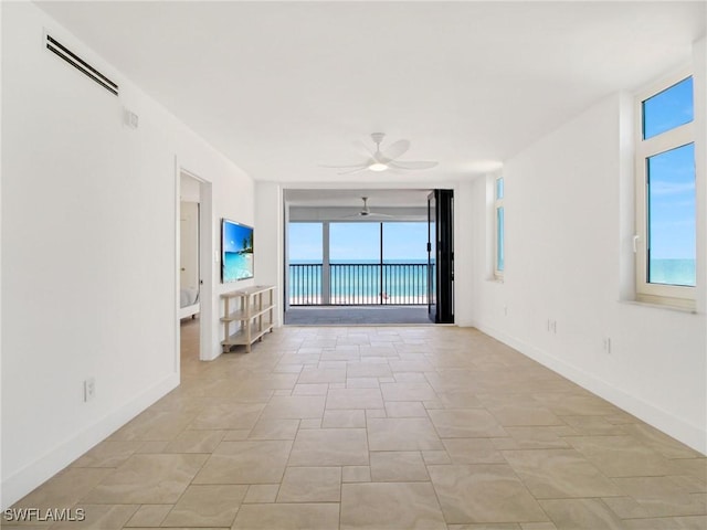 unfurnished living room featuring ceiling fan