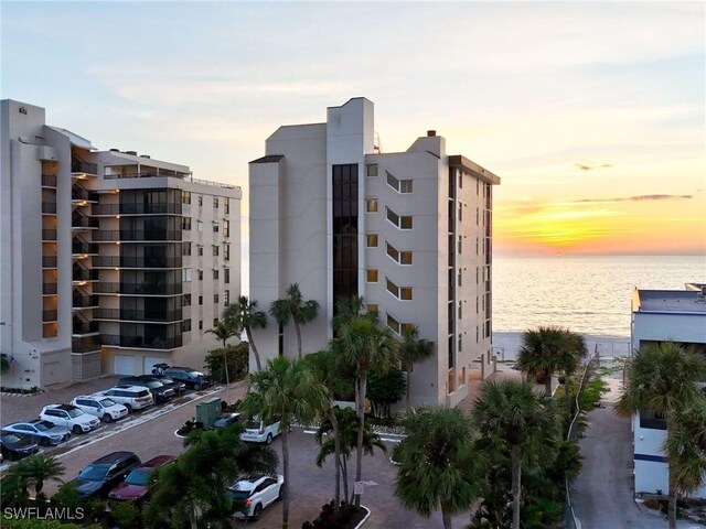 outdoor building at dusk featuring a water view