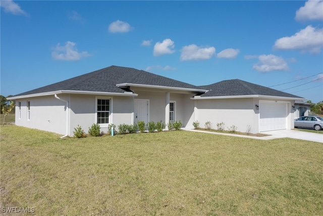 prairie-style house with a garage and a front lawn