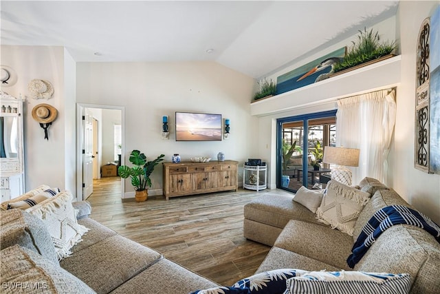 living room with vaulted ceiling and hardwood / wood-style floors