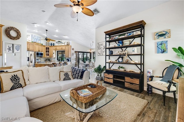 living room featuring lofted ceiling, dark hardwood / wood-style floors, ceiling fan with notable chandelier, and a textured ceiling