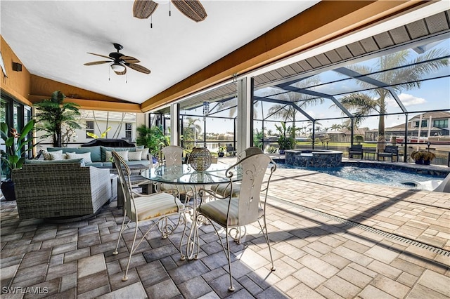 view of patio / terrace with a swimming pool with hot tub, a lanai, and an outdoor hangout area