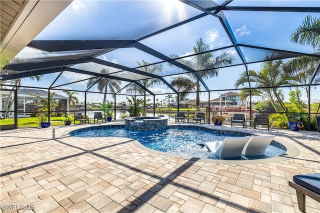 view of swimming pool with a lanai, a patio, and an in ground hot tub