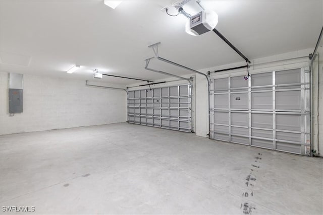 garage featuring a garage door opener and electric panel