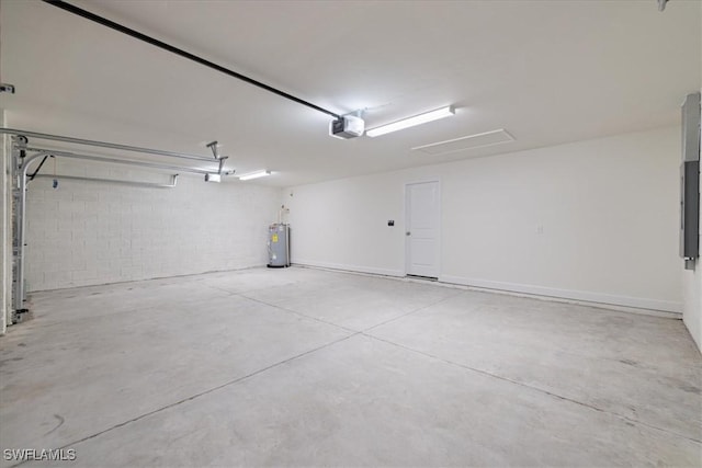 garage featuring a garage door opener and electric water heater