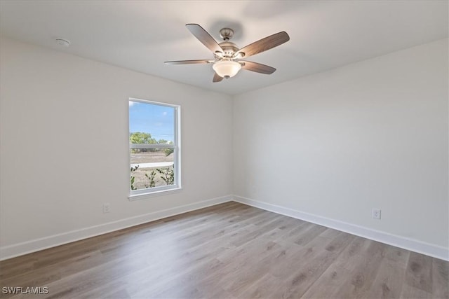 spare room featuring ceiling fan and light wood-type flooring