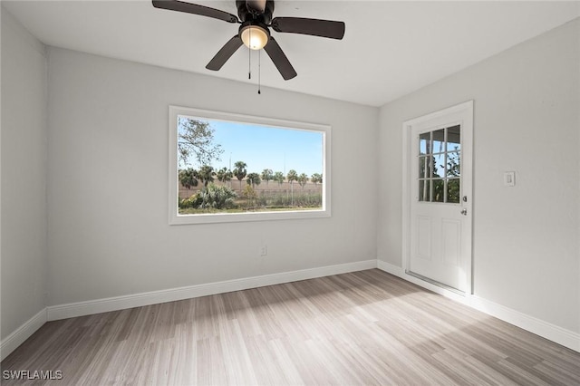 unfurnished room featuring ceiling fan and light hardwood / wood-style flooring