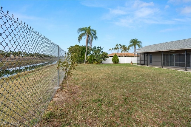 view of yard featuring a sunroom