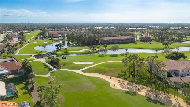 drone / aerial view with a water view, a residential view, and golf course view