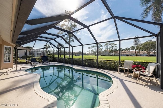 outdoor pool featuring a lanai and a patio area