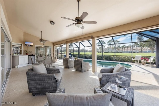 view of patio with an outdoor kitchen, ceiling fan, a lanai, an outdoor pool, and an outdoor living space