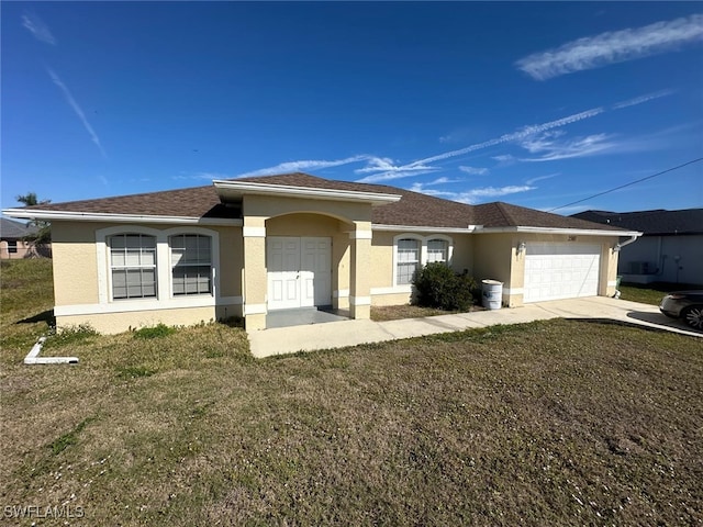 single story home featuring a garage and a front lawn