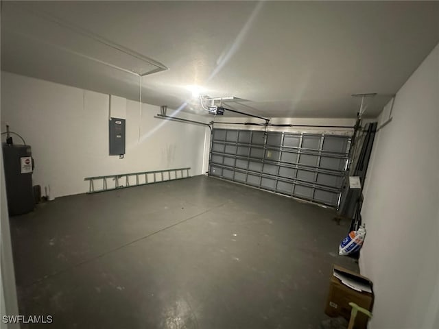 garage featuring a garage door opener, electric panel, and electric water heater