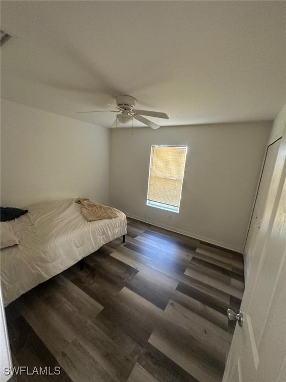 bedroom featuring dark hardwood / wood-style floors and ceiling fan