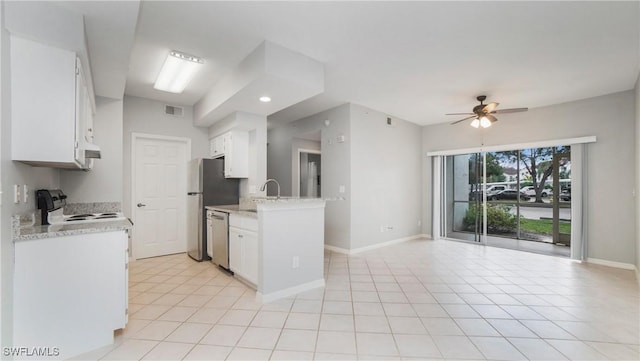 kitchen featuring dishwasher, white cabinets, light tile patterned floors, ceiling fan, and electric stove