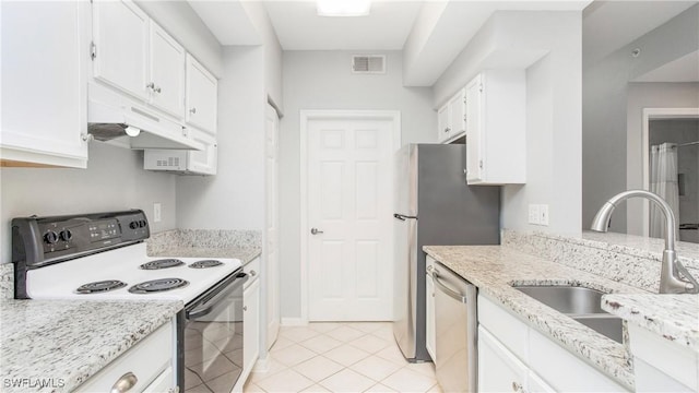 kitchen featuring white cabinetry, sink, light tile patterned floors, stainless steel appliances, and light stone countertops