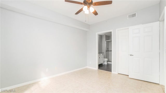 unfurnished bedroom featuring connected bathroom and ceiling fan