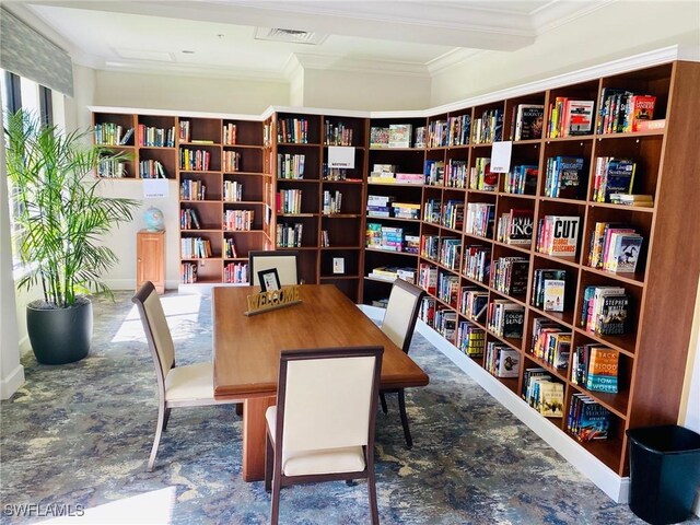 6094 Westbourgh Dr, Naples, FL 34112 - office area with visible vents, ornamental molding, and wall of books
