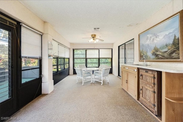 6094 Westbourgh Dr, Naples, FL 34112 - sunroom featuring a ceiling fan and a sink