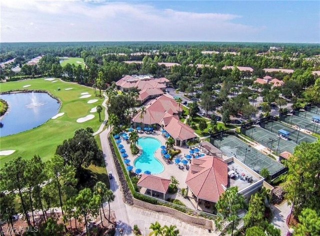 aerial view with a water view, view of golf course, and a residential view