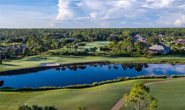 drone / aerial view with a water view, golf course view, and a residential view