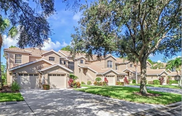 mediterranean / spanish-style home featuring a front yard