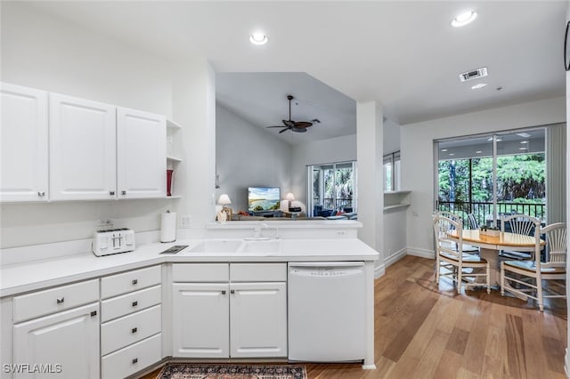 kitchen with ceiling fan, lofted ceiling, white dishwasher, and white cabinets