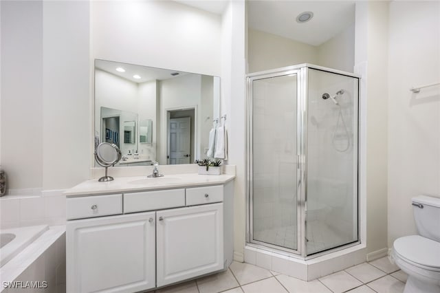 full bathroom with plus walk in shower, vanity, tile patterned floors, and toilet