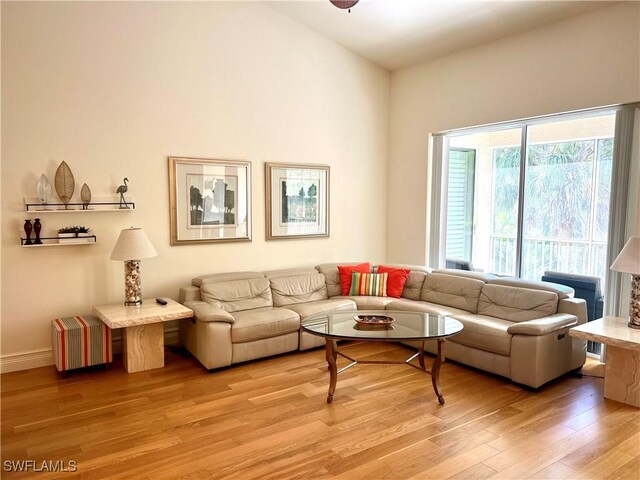 living room featuring light wood-style floors and baseboards