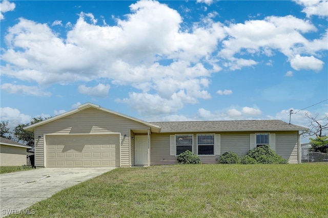 ranch-style home featuring a garage and a front lawn