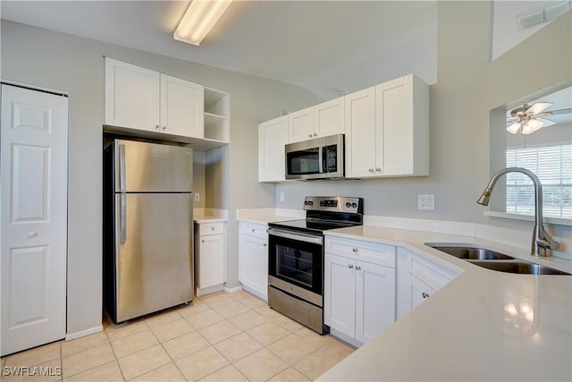 kitchen with white cabinetry, appliances with stainless steel finishes, and sink