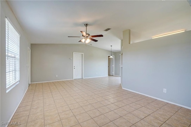 tiled spare room featuring ceiling fan and lofted ceiling