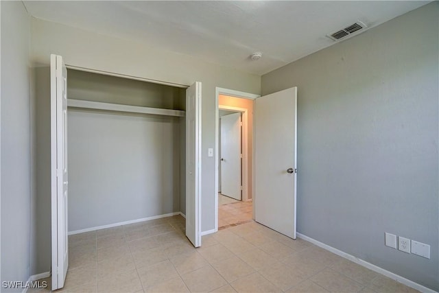 unfurnished bedroom with a closet