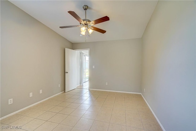 tiled empty room with ceiling fan