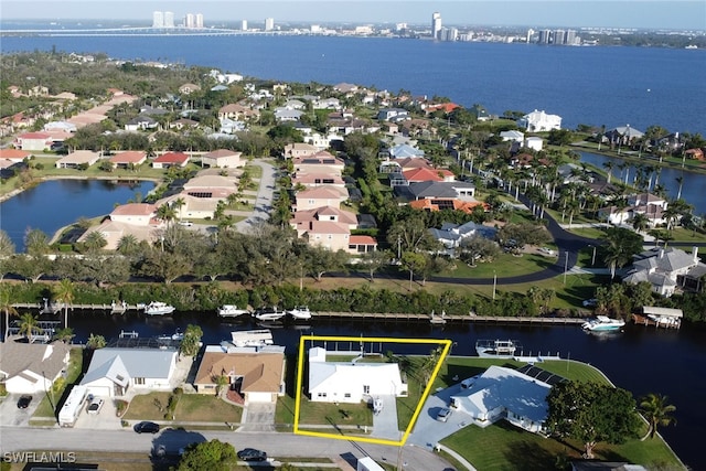 birds eye view of property featuring a residential view and a water view