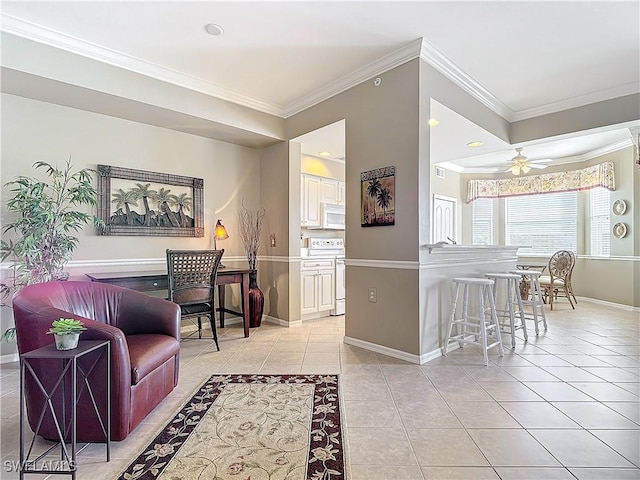 living room featuring crown molding, ceiling fan, and light tile patterned floors