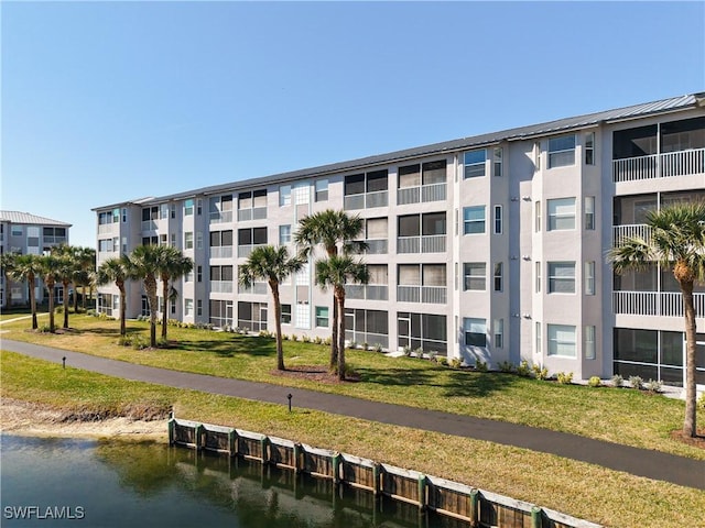 view of building exterior featuring a water view