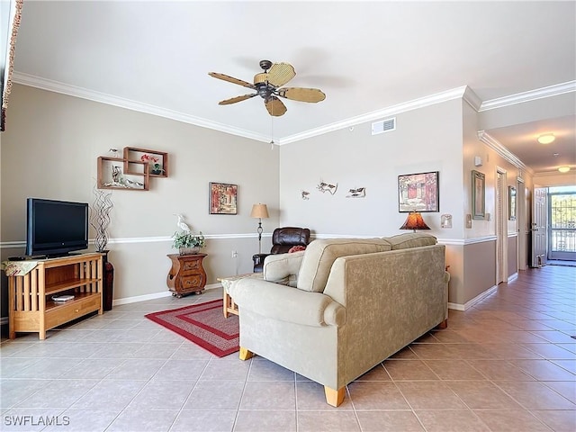 tiled living room with ceiling fan and ornamental molding