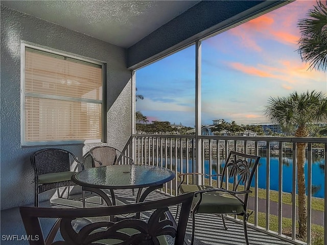 sunroom with a water view