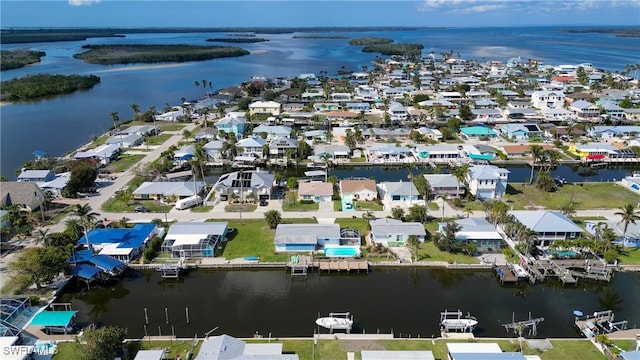 bird's eye view featuring a residential view and a water view