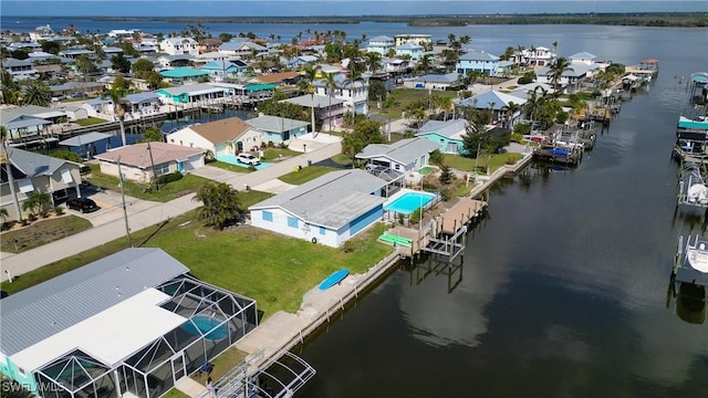 birds eye view of property featuring a residential view and a water view