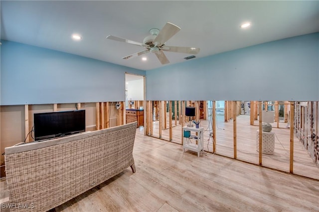 interior space with ceiling fan and visible vents