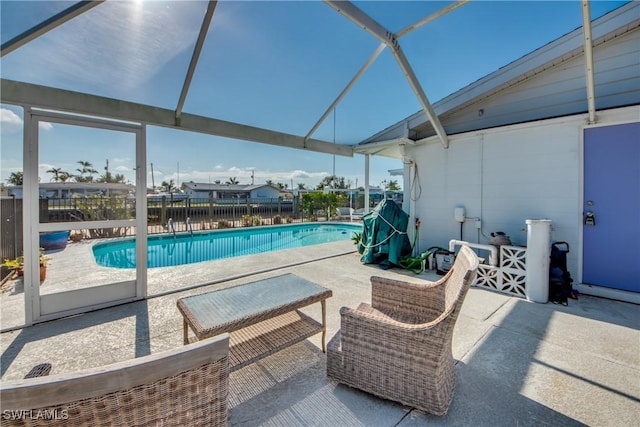 view of pool featuring a fenced in pool, an outdoor hangout area, a lanai, fence, and a patio area