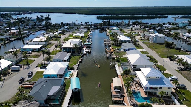 bird's eye view featuring a residential view and a water view