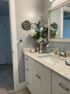 bathroom featuring vanity and baseboards