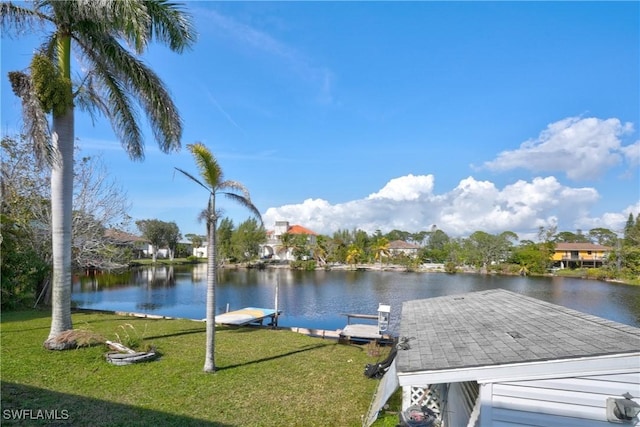 view of dock featuring a water view and a lawn